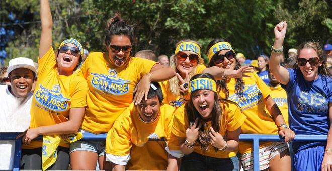 a group of sjsu students cheer during a spirit event
