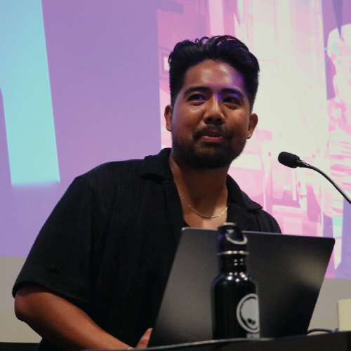 Asian Man at Lectern
