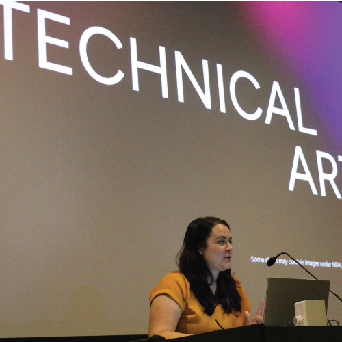 Women at lectern with Technical Art on a screen