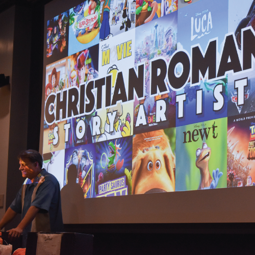 Christian Roman in front of a series of movie posters