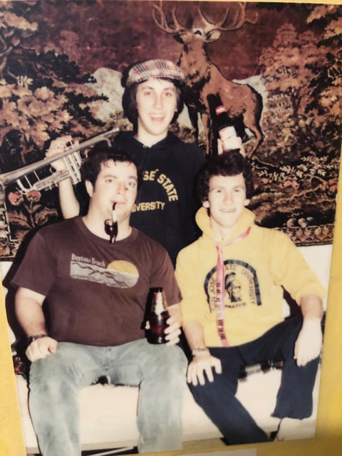A sepia-tinged photo of three young students, Kevin, Bob, and Peter