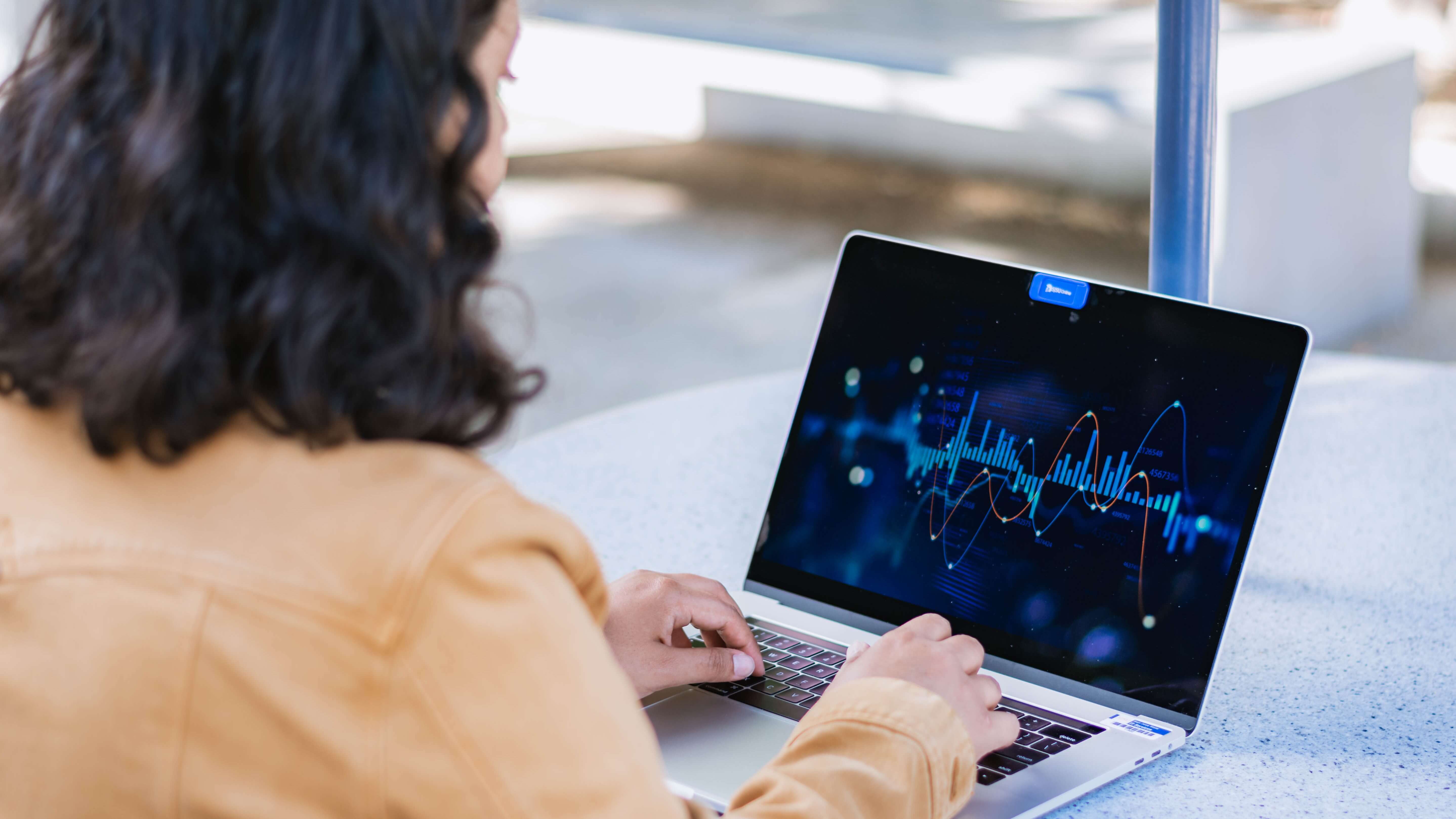 Student analyzing data on a laptop.