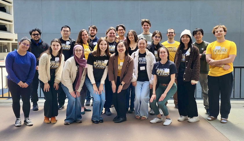 Students and faculty members pose in matching T-shirts at the SJSU College of Science Student Research Day.