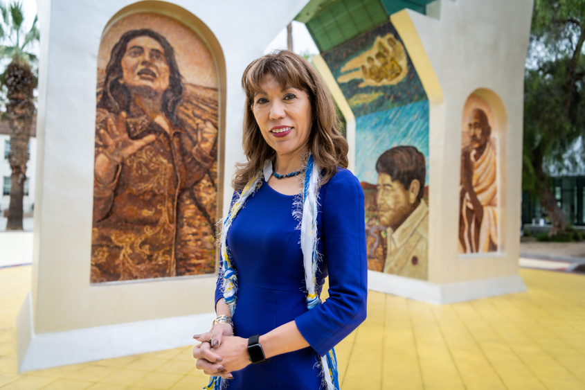 President Matson-Tiente posing in front of the Chavez Arch.