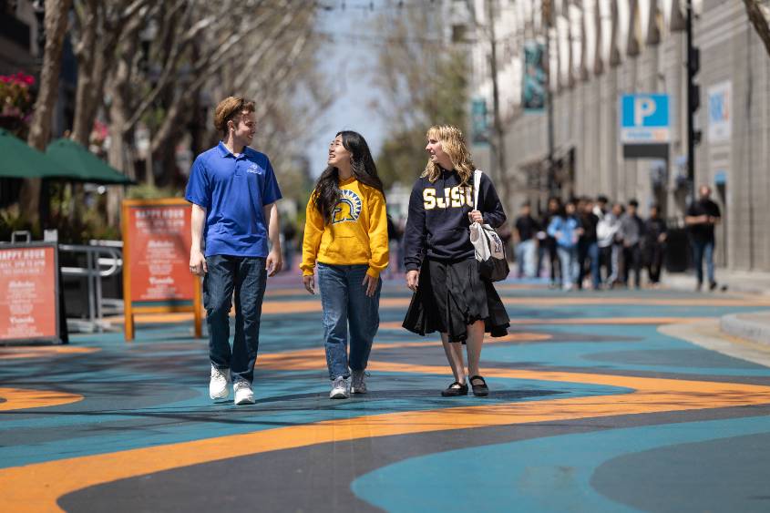 Students walking down the main corridor of San Pedro Square in downtown San Jose.